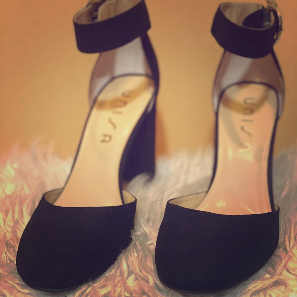 Closed-toed, ankle strap chunky heels.